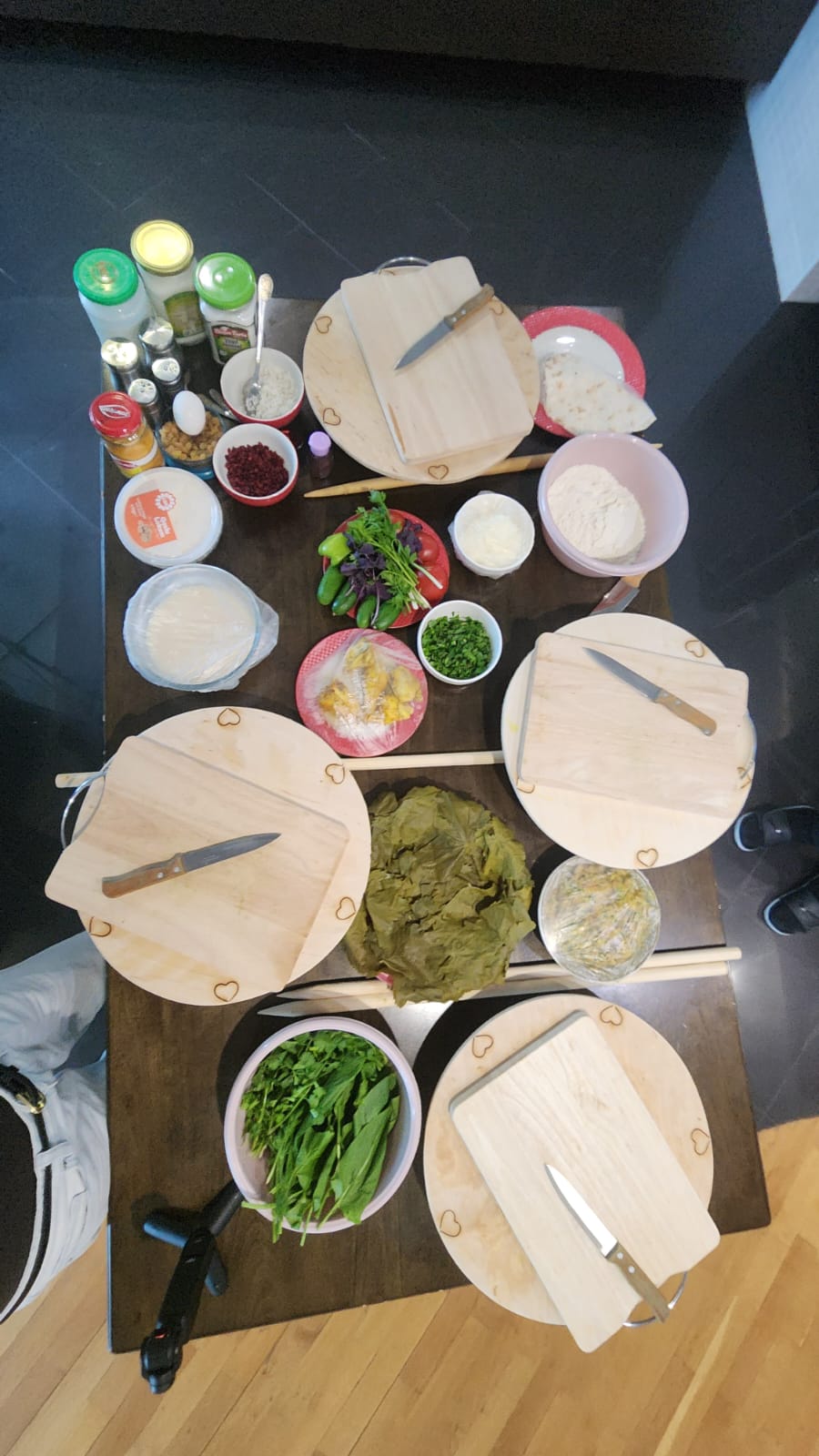 Fresh herbs and ingredients prepared for an Azerbaijani cooking class