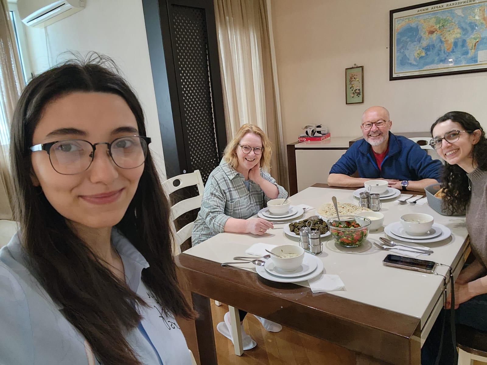 Guests sharing Azerbaijani dishes after a cooking class in Baku