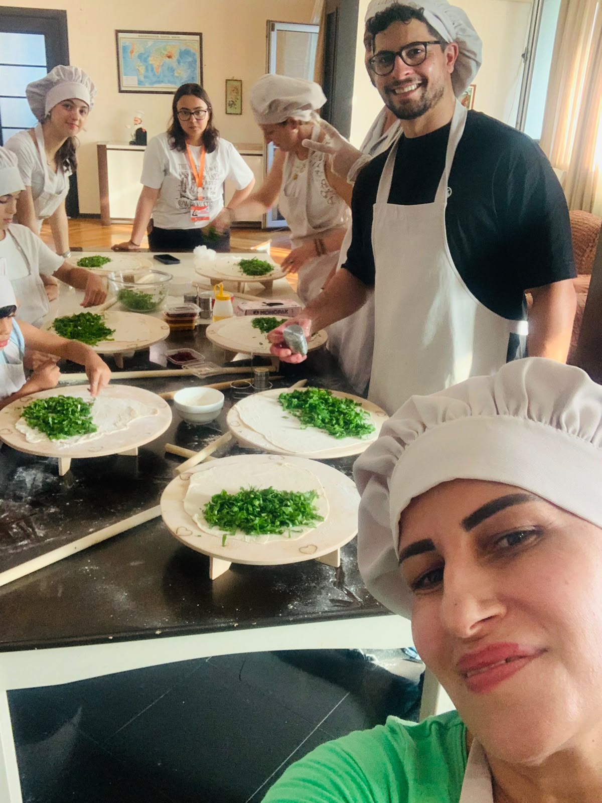 Travelers preparing dolma in an Azerbaijani cooking workshop